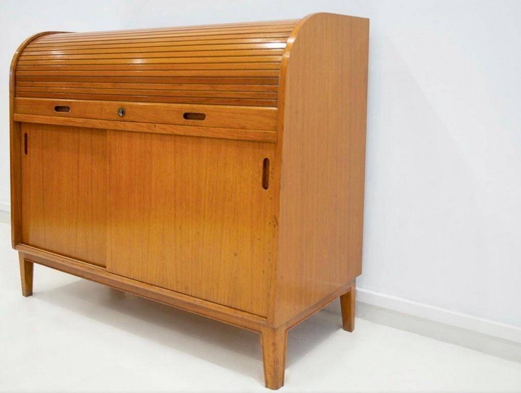 Modern Scandinavian wardrobe in teak with sliding doors and drop-down flap.