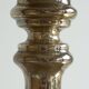 Antique mercury glass candlestick with a patina and silver finish.