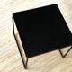 Black "flying" coffee table by Pierre Guariche for Steiner