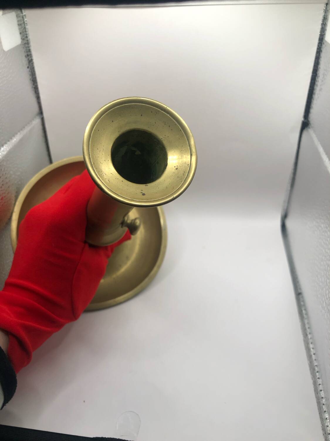 Candle holder with a pusher