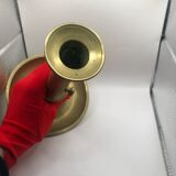 Candle holder with a pusher