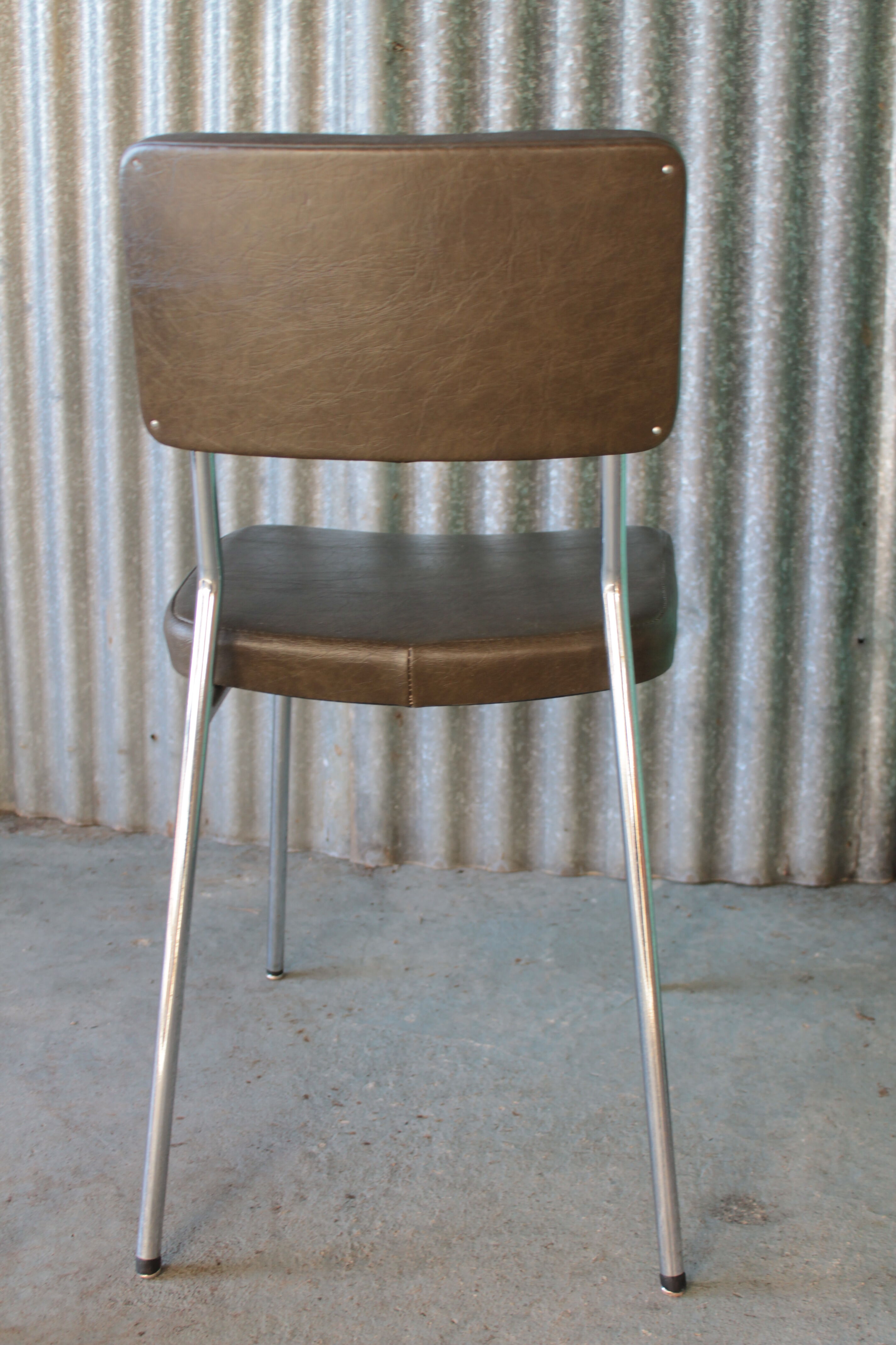 3 bronze-green faux leather chairs with chrome frames