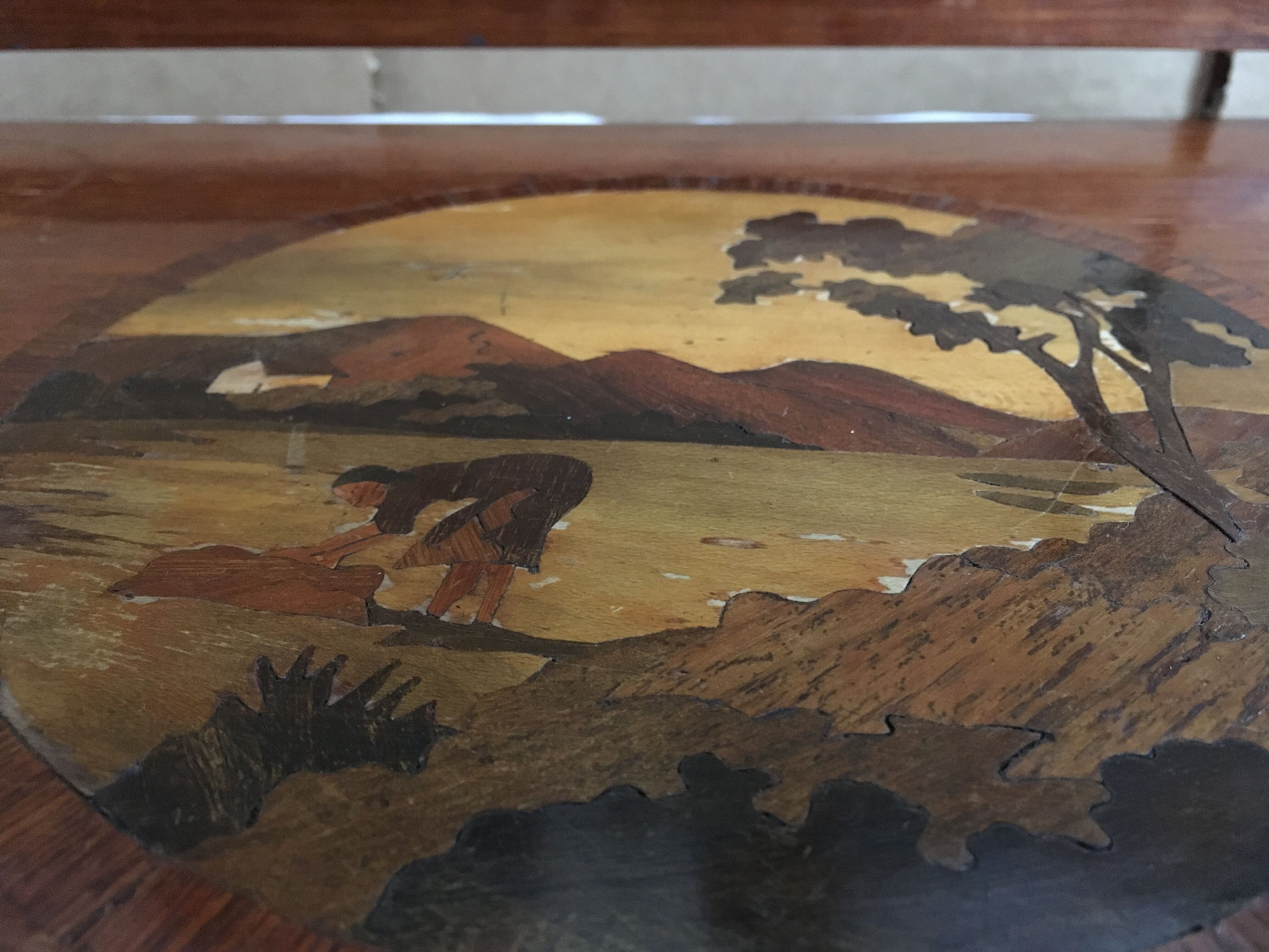 Old wooden serving tray with marquetry drawing