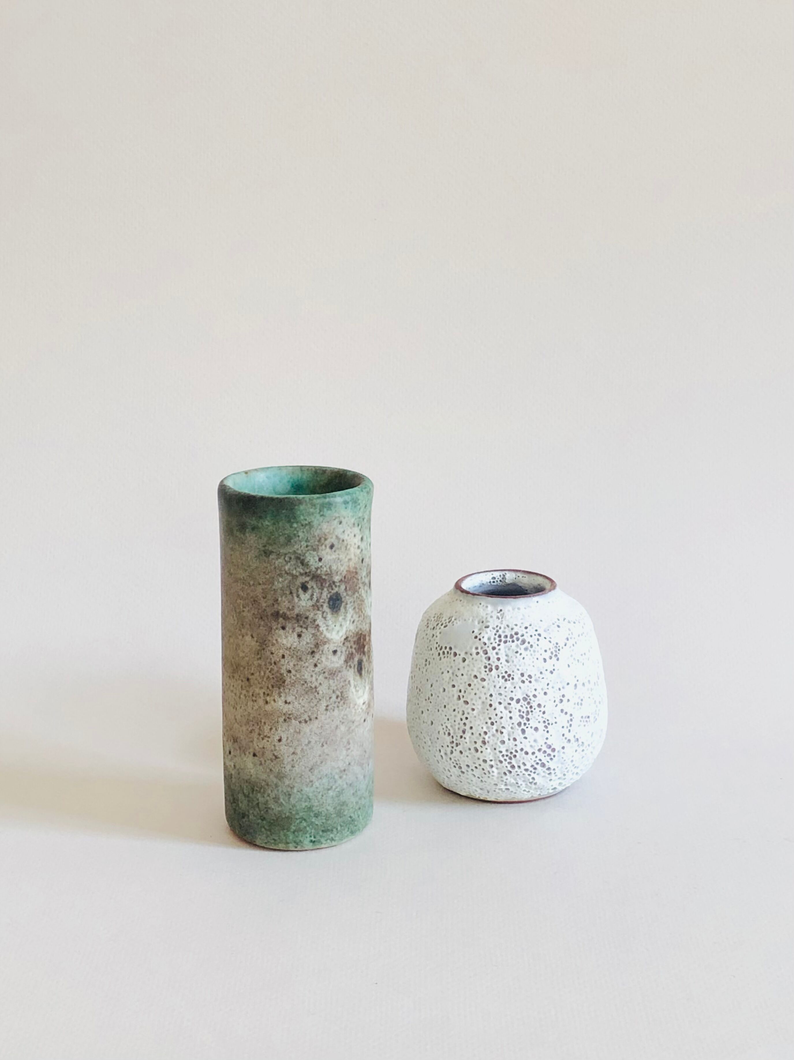 Duo of small sandstone vases