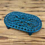 Dessous de plat ajouré en fonte bleu émaillé