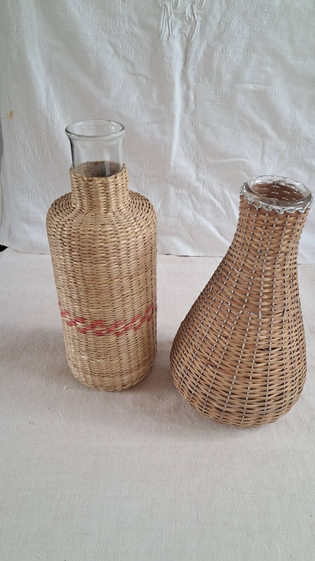 Pair of glass carafes / vases dressed in vintage woven rattan – A