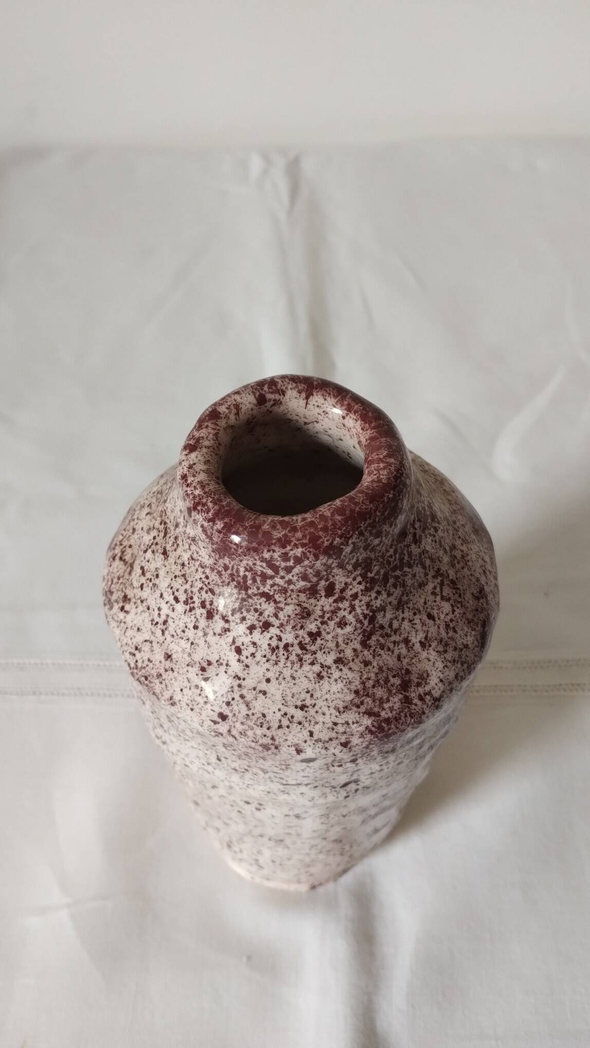 White ceramic vase with brown speckles