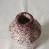 White ceramic vase with brown speckles