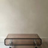Smoked plexiglass coffee table on wheels, Roche Bobois design 1970.