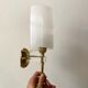 Pair of gold steel wall lamps, plexi and pleated plastic shades 60s-70s