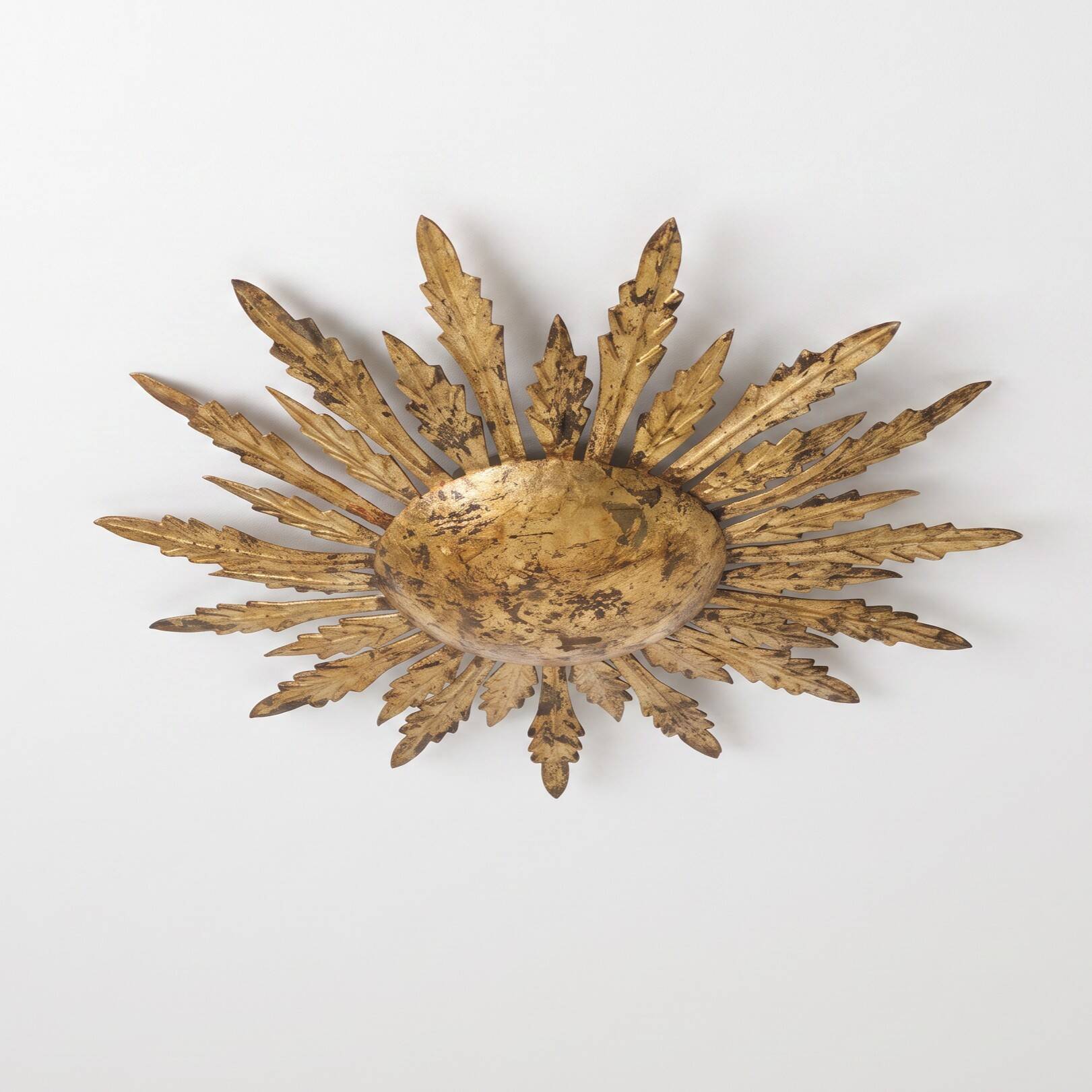 Mid-century sun ceiling lamp in gilded metal with leaf rays, 1950s