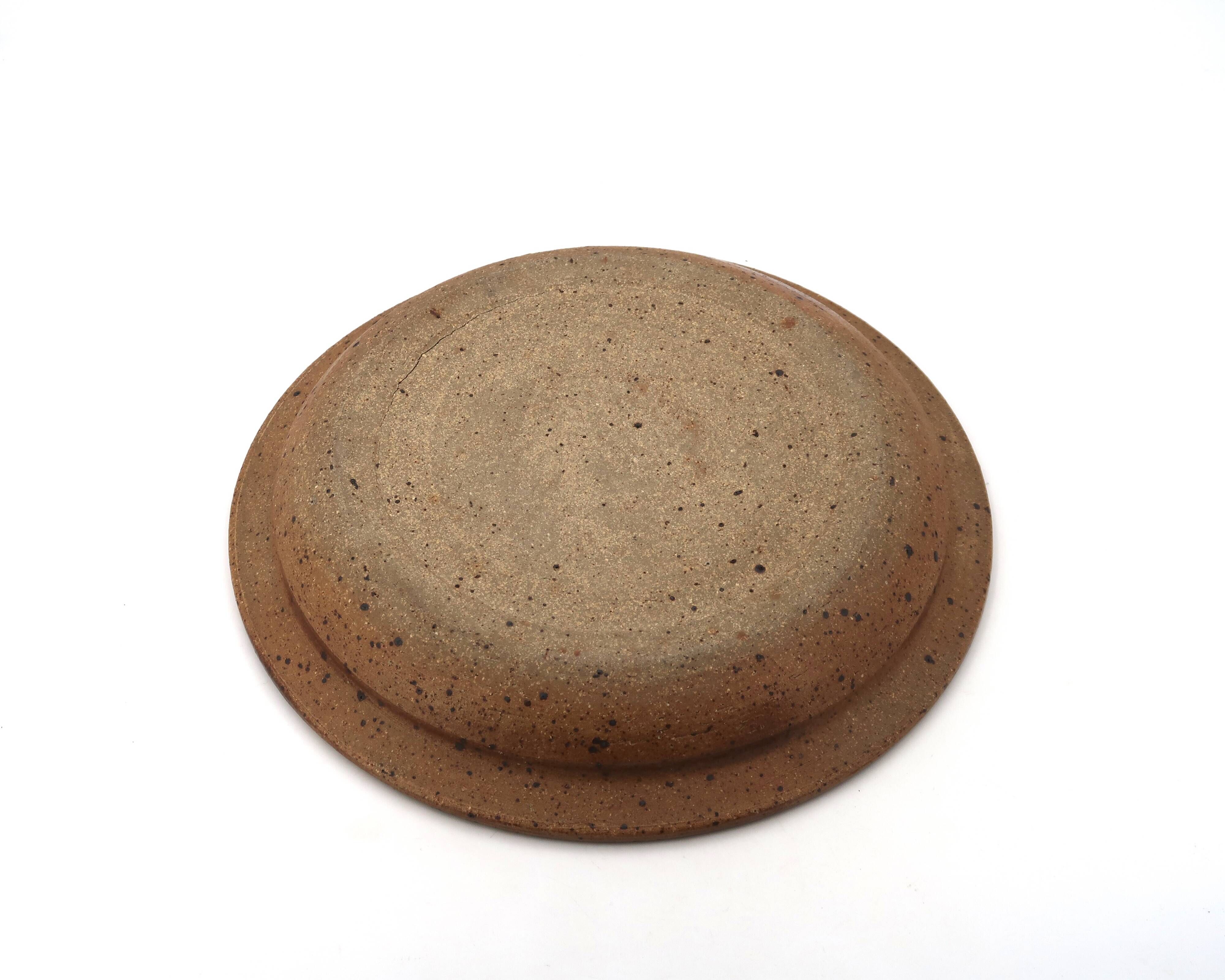 Round hollow plate in stoneware by Pierre Digan, La Borne, blue ceramic from the 1960s.