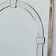 Large Art Deco style beveled wall mirror with architectural arch design