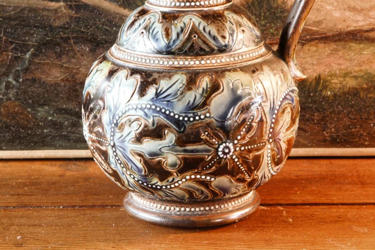 Doulton Lambeth stoneware jug (1879), floral decoration by Henry Winstanley.