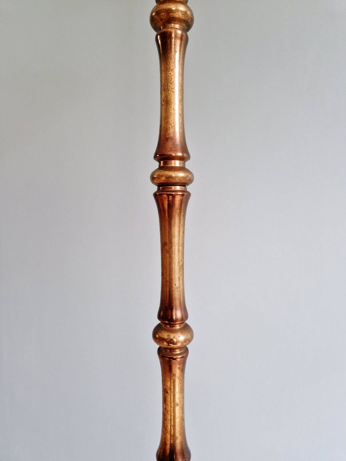 Brass floor lamp with rattan shade, 1950s-60s.