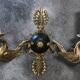 Antique bronze wall light with arm decorated with swans and palmettes in the Empire style