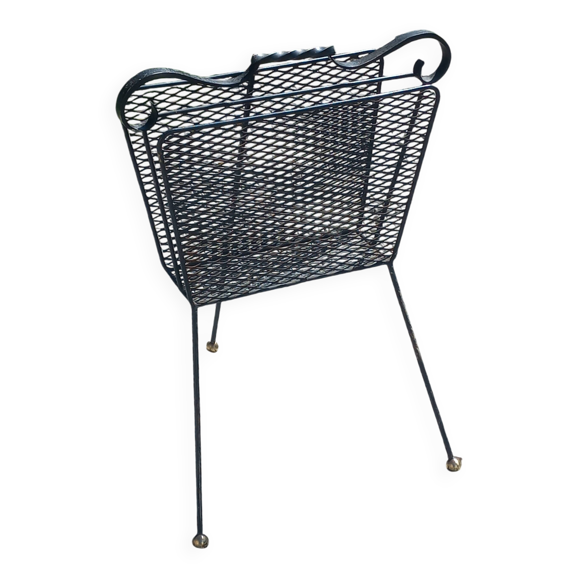 Perforated metal magazine rack from the 1960s.