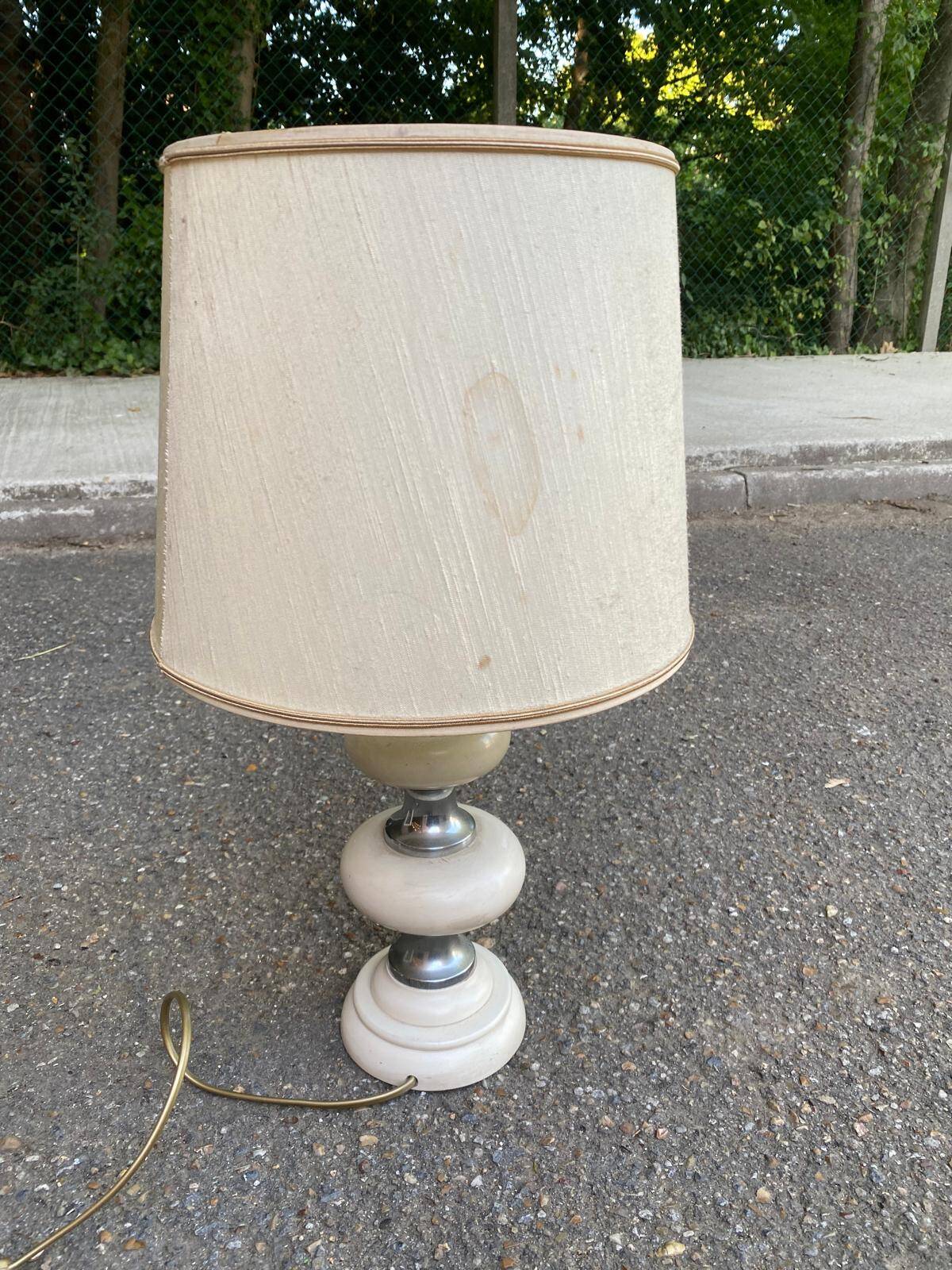 Space age bedside lamp in off-white wood with a metal band.