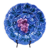 Blue slip plate decorated with a bunch of Sarreguemines grapes
