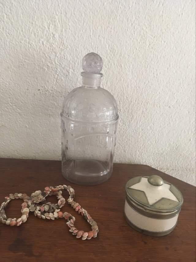 Guerlain bottle with bees.