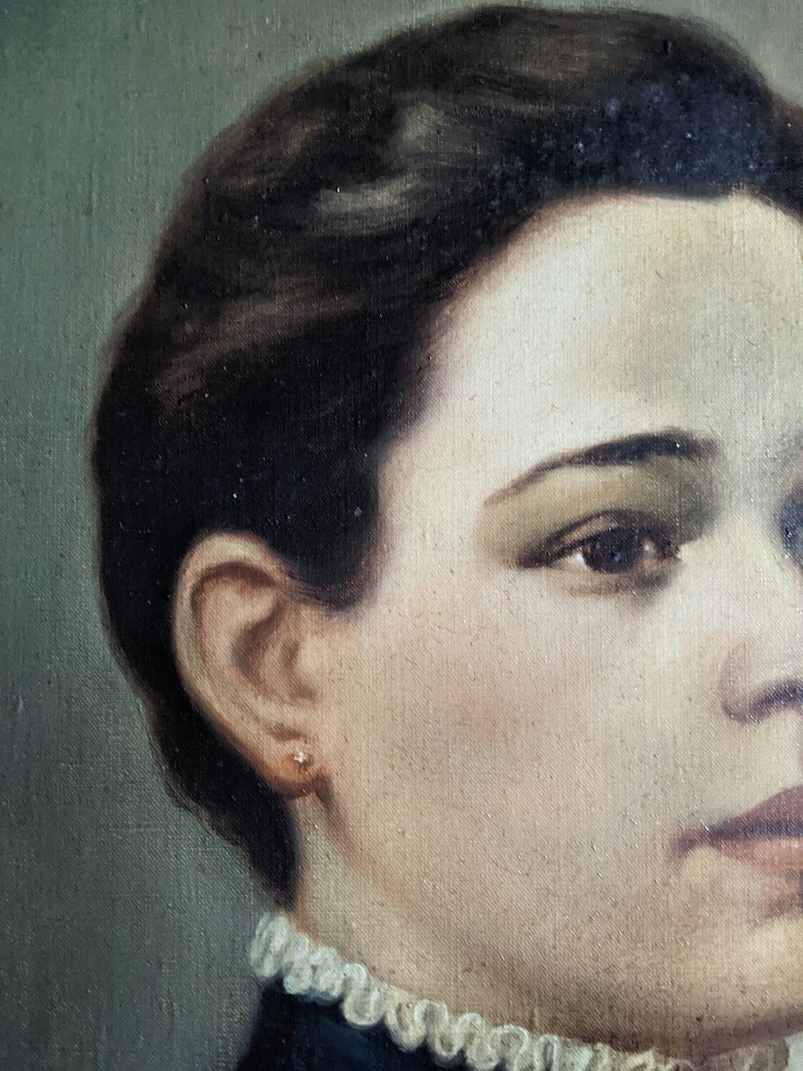 Oil on canvas portrait in an antique gilded wooden frame.