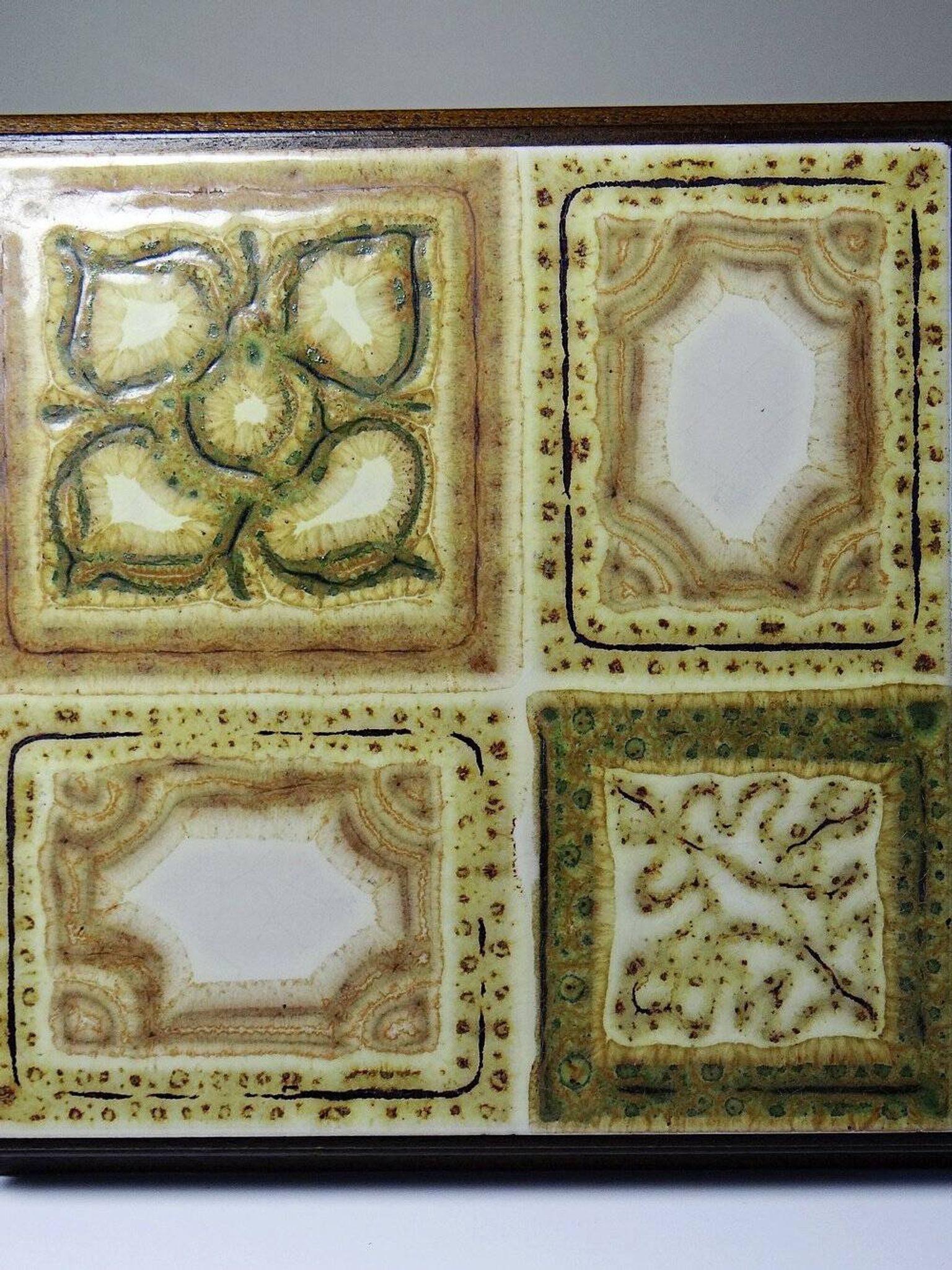 Vintage ceramic and wooden trivet, circa 1960-1970.