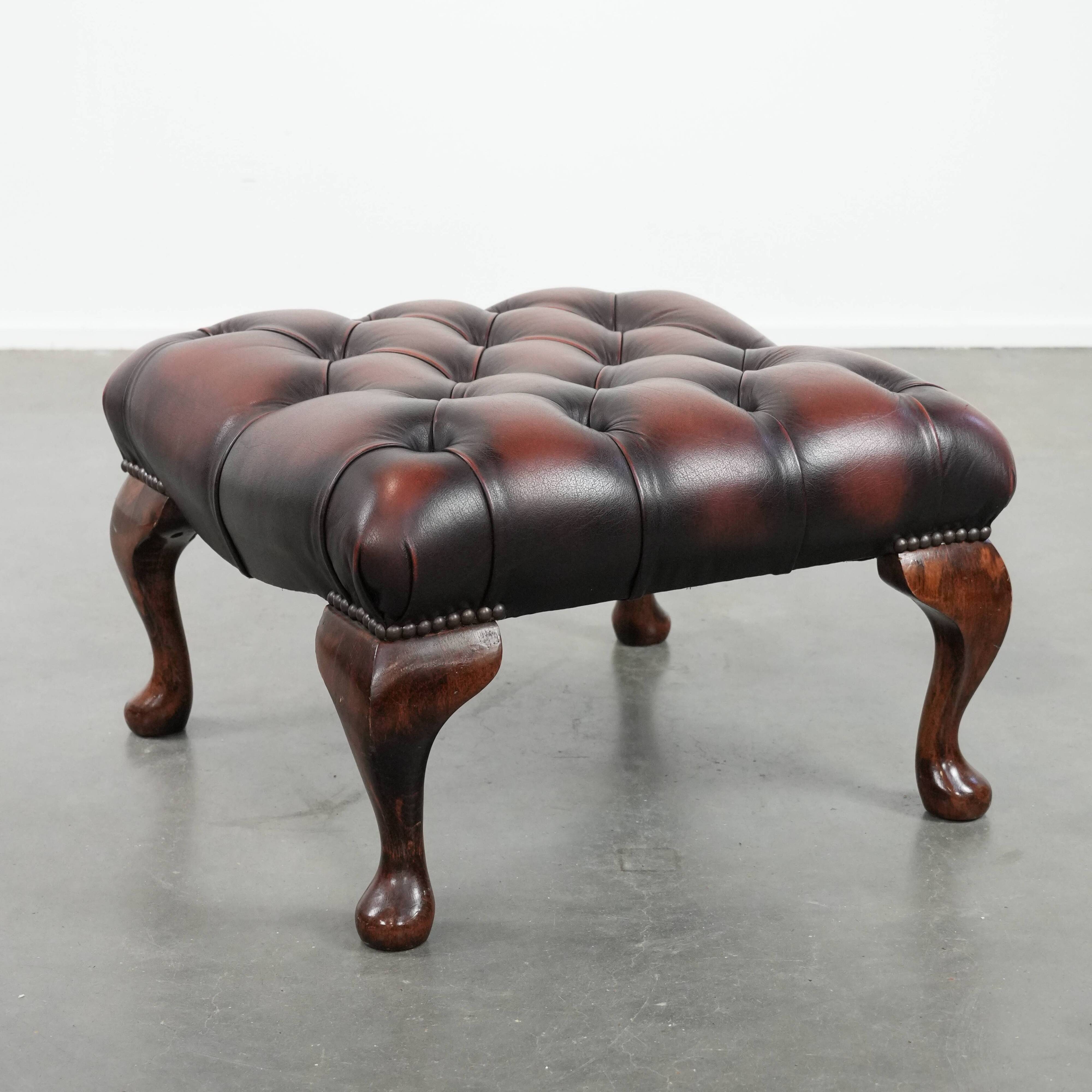 Dark brown chesterfield ottoman in cowhide leather