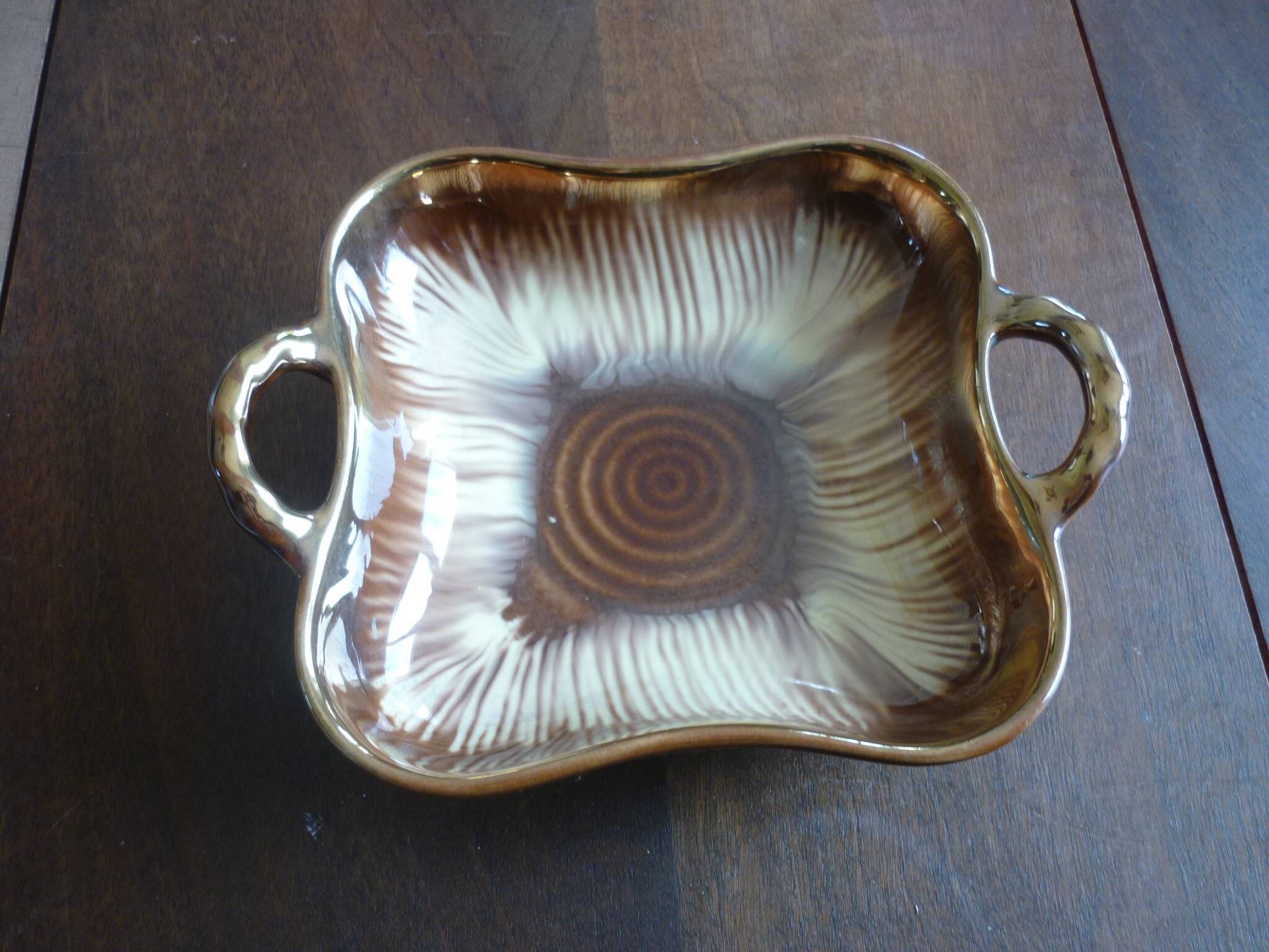 Square dish with brown and gold handles