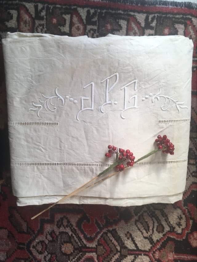 Mixed-race sheet with JPG monogram.