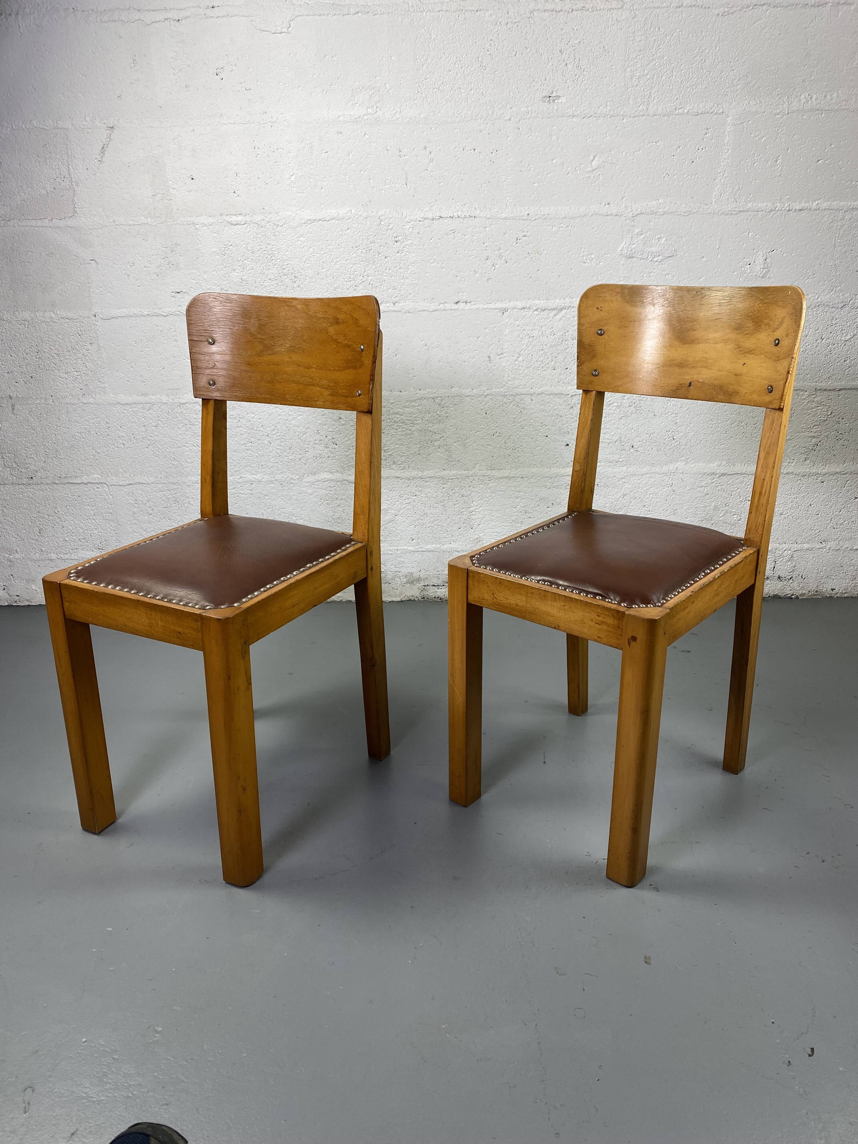 Pair of wooden and leather chairs