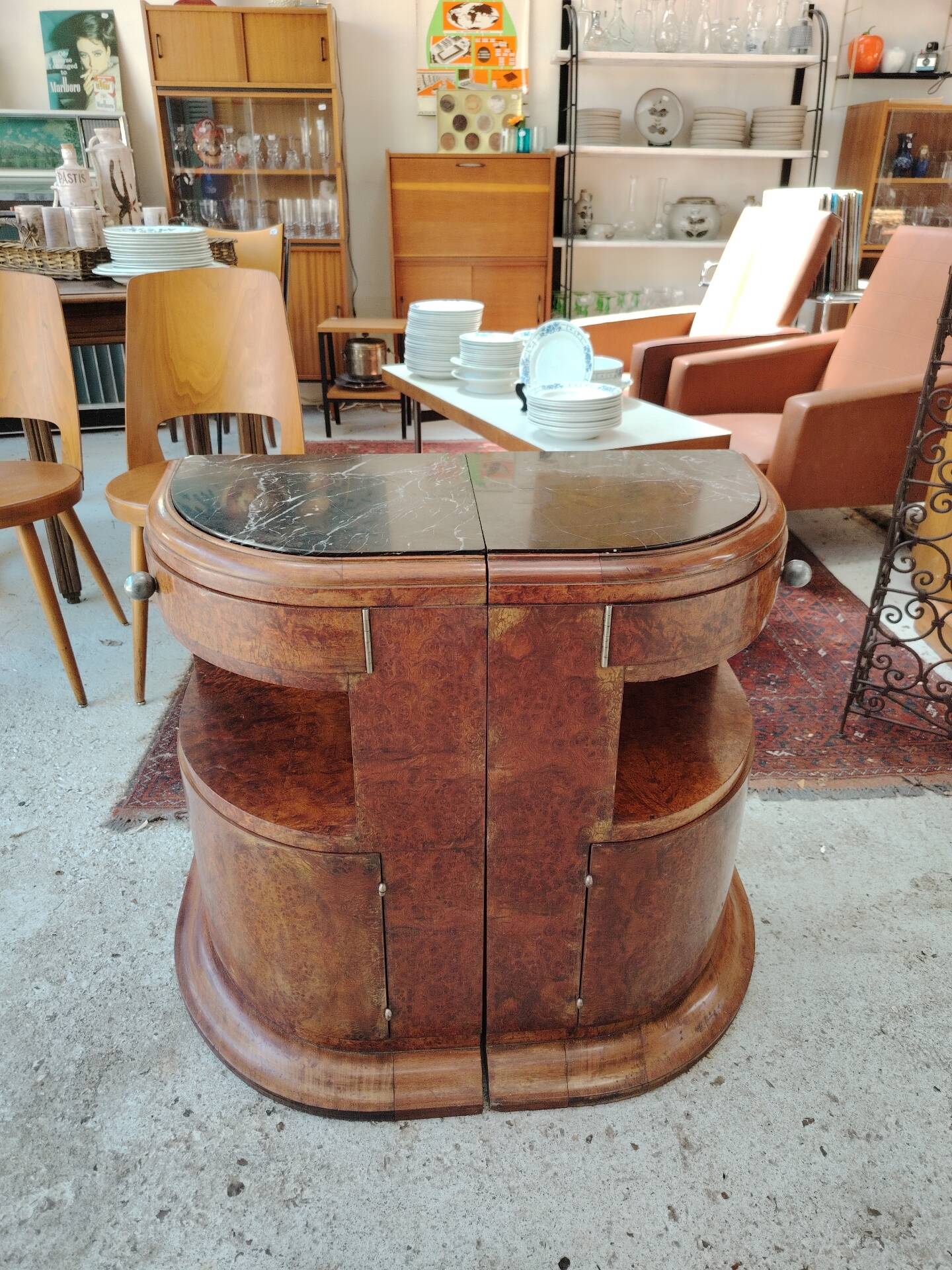 Pair of Art Deco half-moon bedside tables in walnut veneer and black marble.