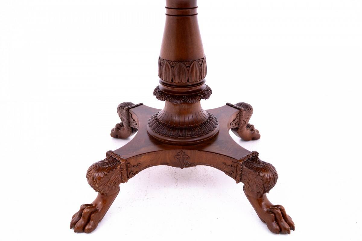 Late 19th century lion's paw table with chairs, Northern Europe.