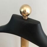 Neoclassical style valet stand in brass and black lacquered wood. French work. Circa 1940