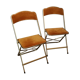 Two gold velvet folding chairs
