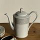Bavarian porcelain teapot from Germany with blue frieze and flower lid H23