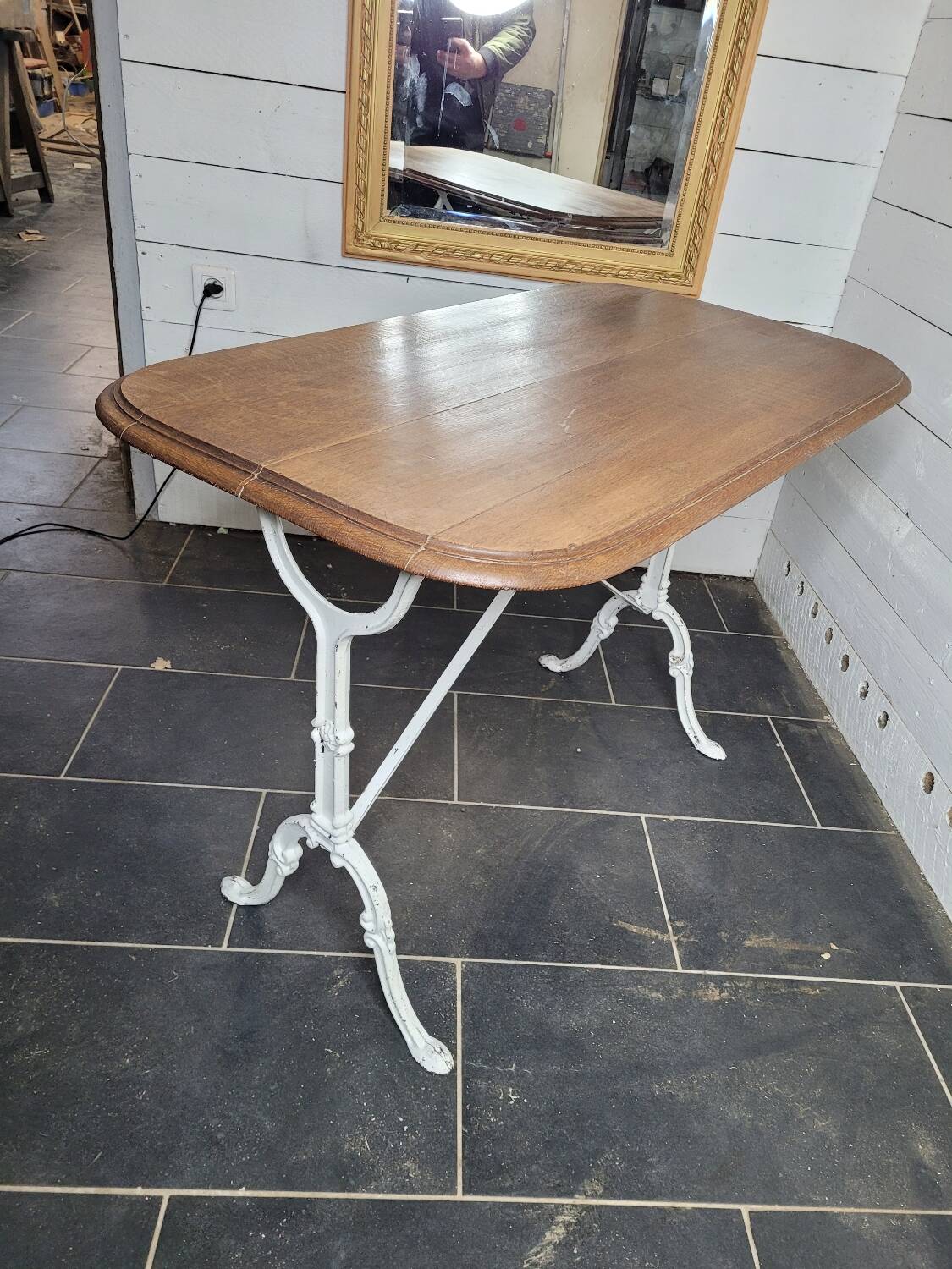 Bistro table with cast iron base and oak top