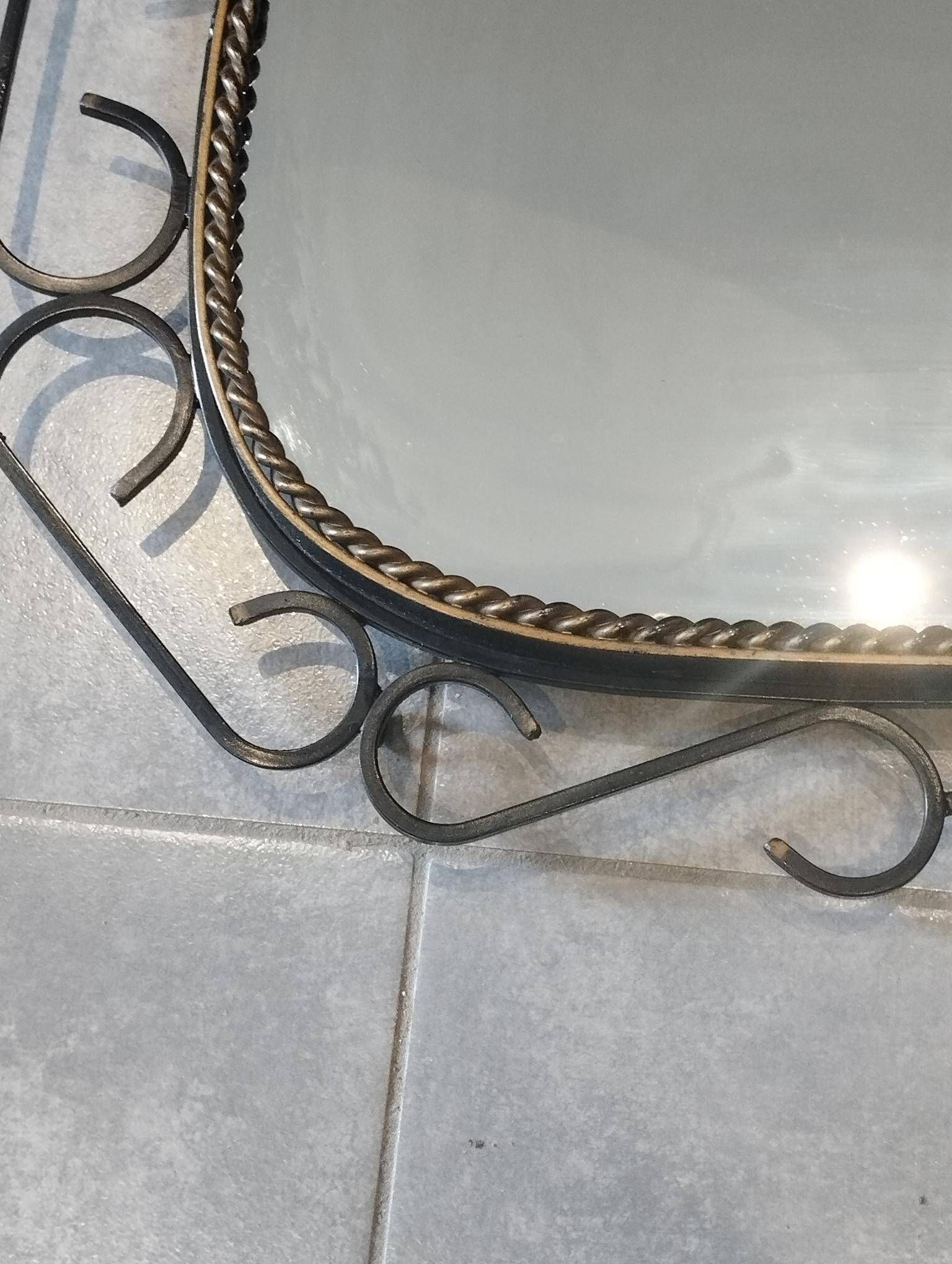 Mid-century modern iron mirror, brutalist, vintage organic, thick sixties.