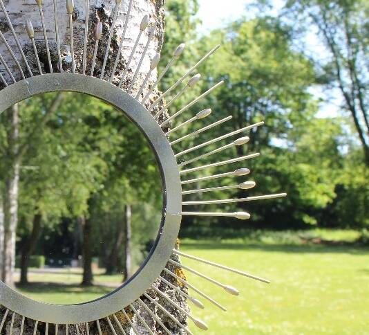 Miroir soleil métal doré