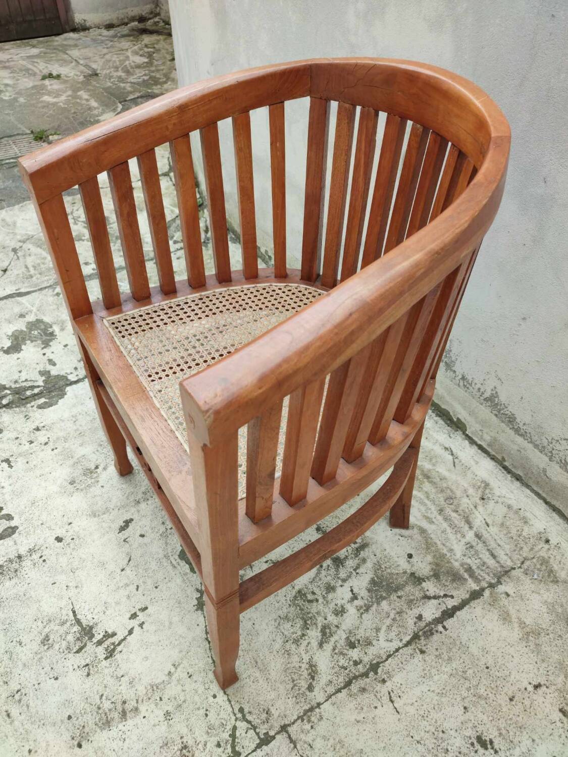 Old vintage teak wood cane armchair