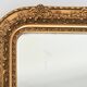 Wooden mirror and gilded stucco decorated with rockery style rinceaux and shells