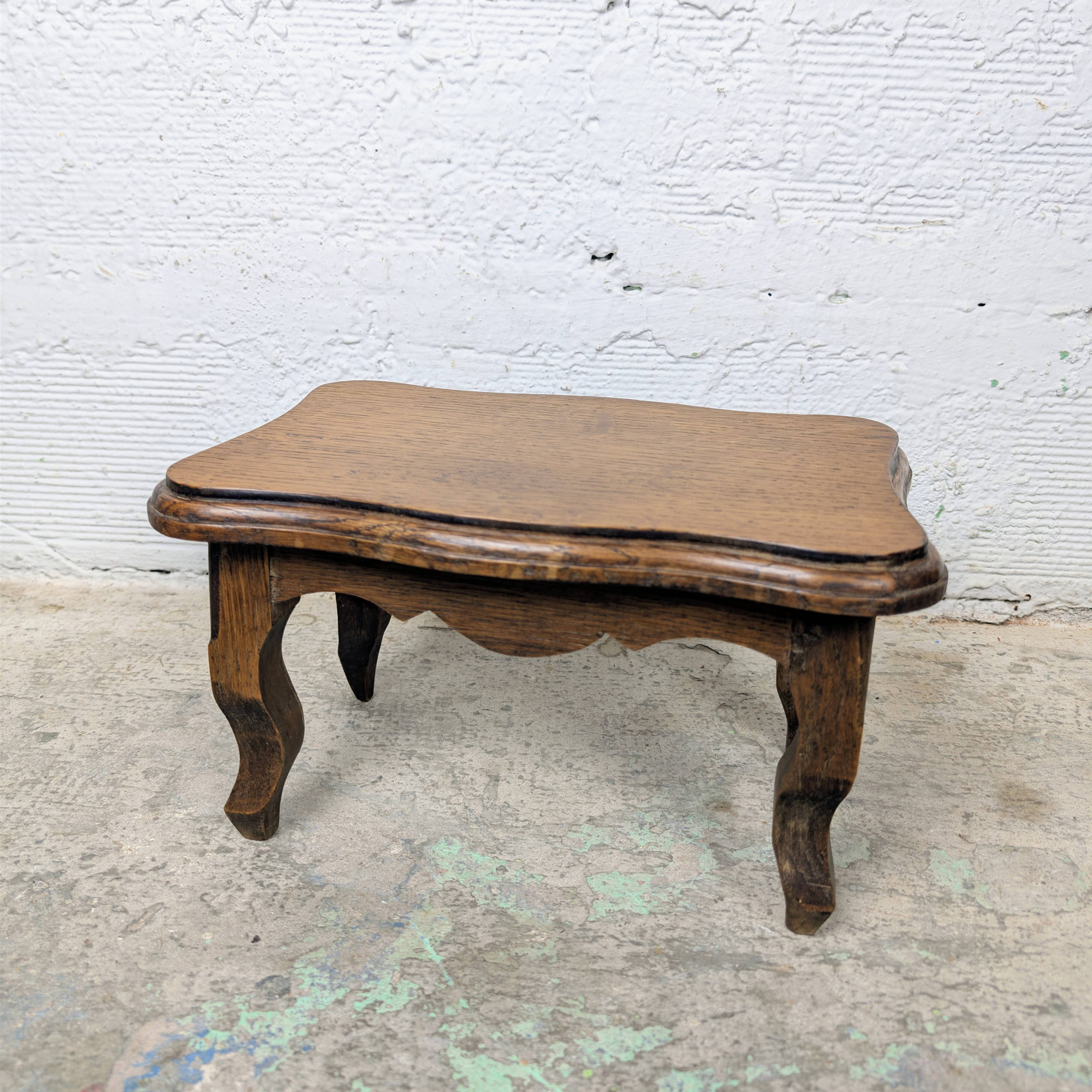 Antique footstool with rustic charm