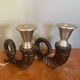 Pair of bronze candlesticks by Chapman