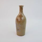 Brown ceramic/stoneware bottle with chiseled floral pattern