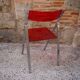 Red Plexiglas folding chair