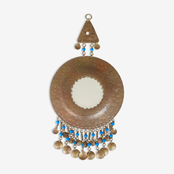 Round brass ethnic mirror decorated with pearls, 60s