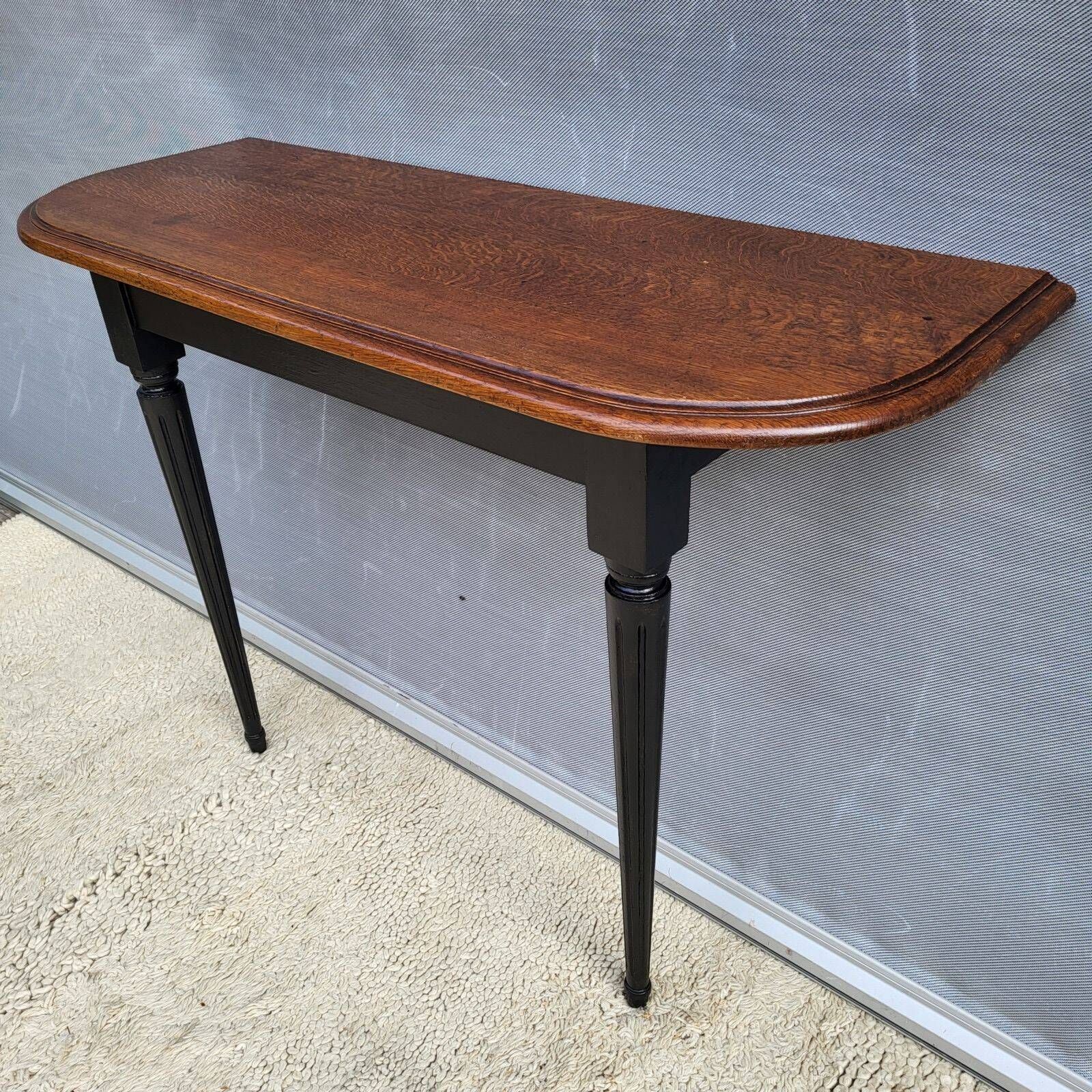 Console bicolore noire et chêne style Louis XVI restaurée