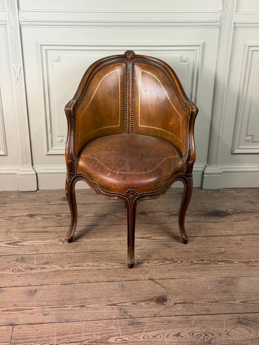Louis XV style office chair in carved wood, brown leather, circa 1920.