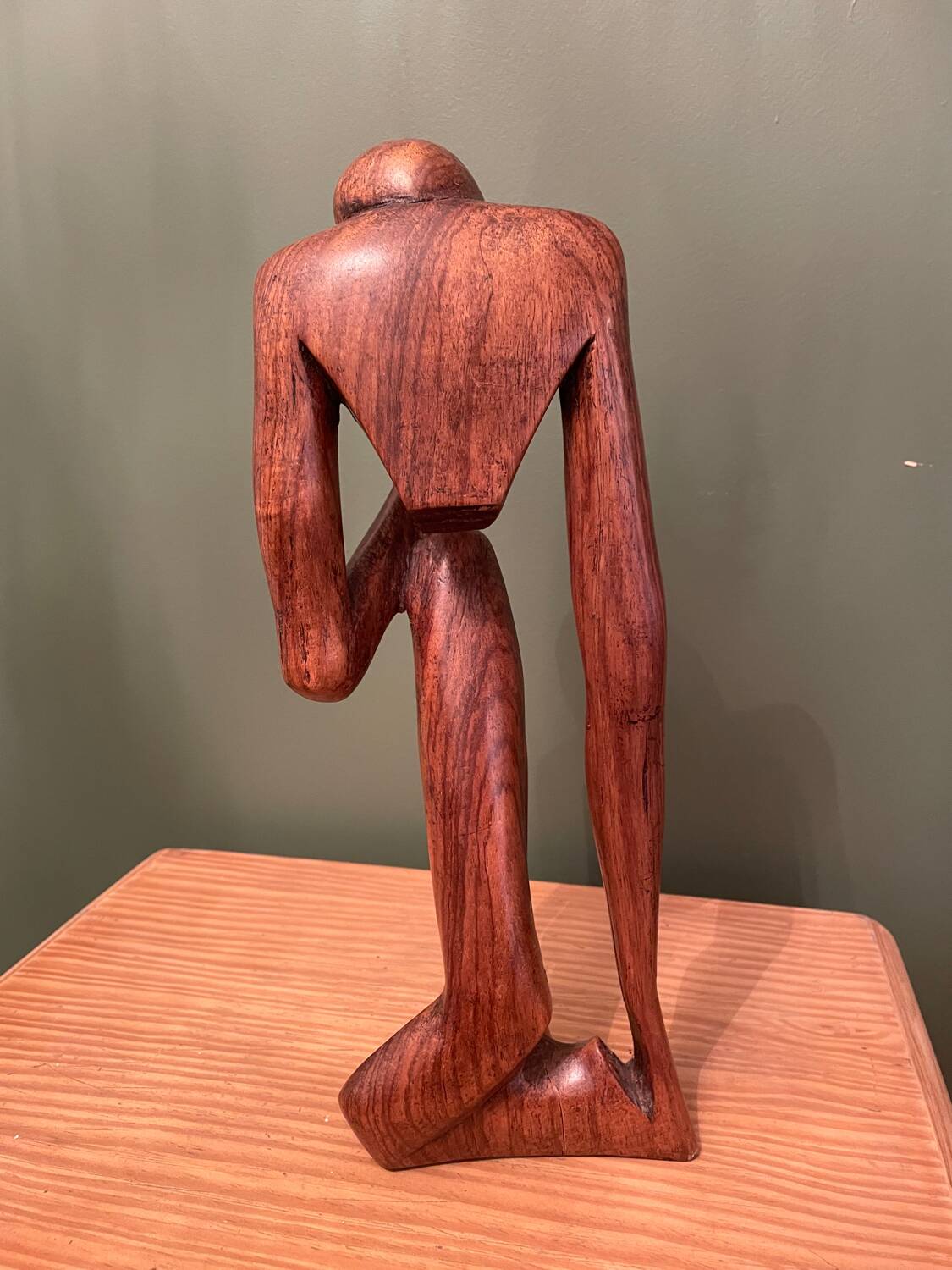 Wooden sculpture inspired by Rodin's "The Thinker"
