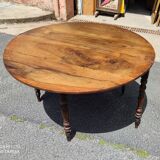 Half moon console opening on a solid walnut round table