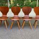 4 vintage Scandinavian dining chairs in curved walnut.